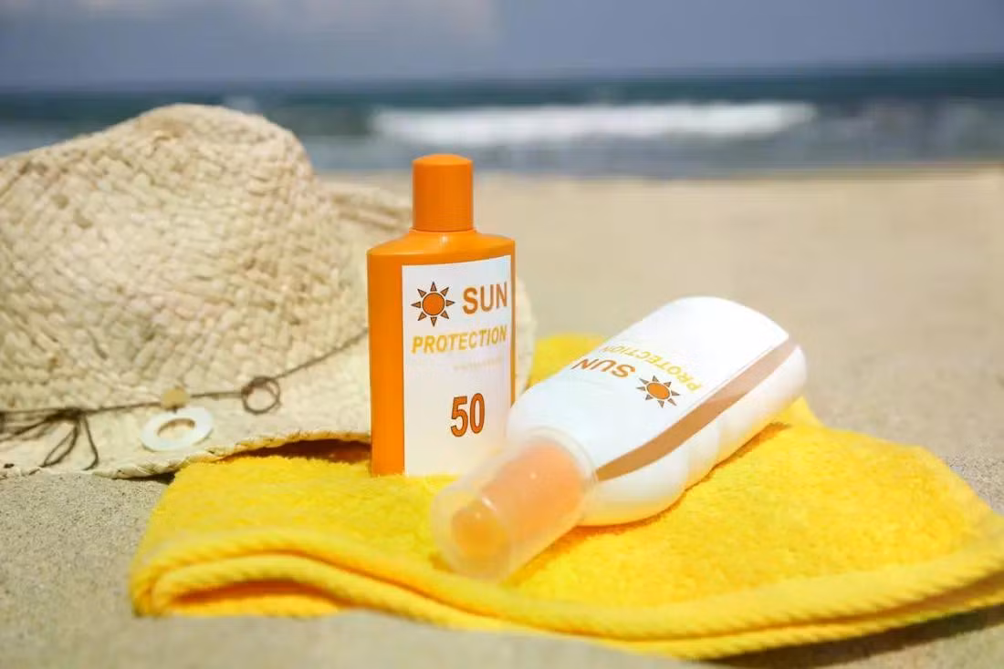 sunscreen-bottles-on-a-beach.jpg