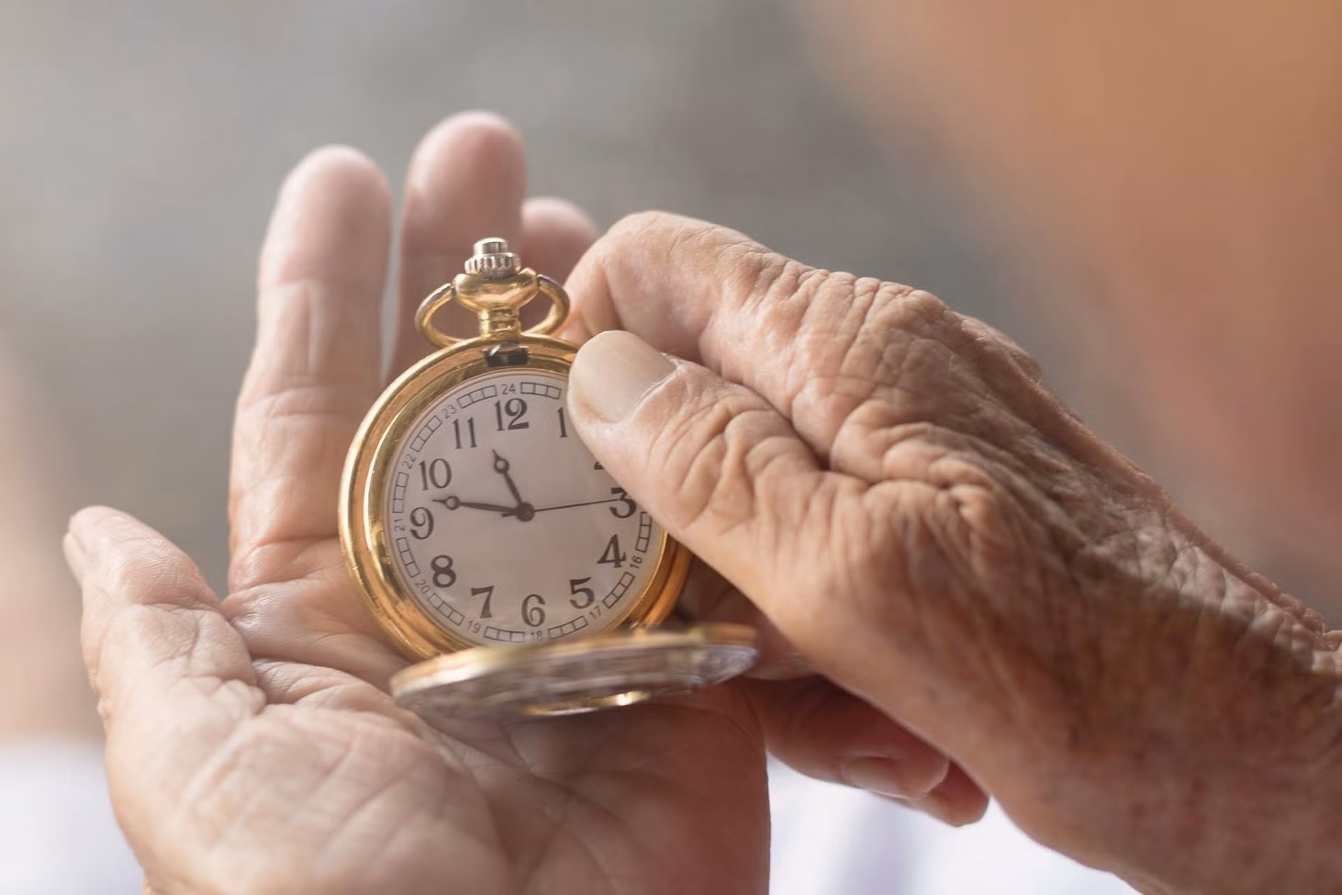 old-woman-hands-clock.jpg