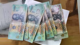 Ngân hàng phải báo công an khi phát hiện từ 5 tờ tiền giả trong giao dịch