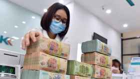 Lãi suất huy động dự kiến hạ nhiệt bất chấp áp lực tín dụng dâng cao