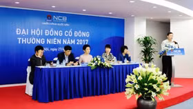 Ai đang “thổi giá” cổ phiếu ngân hàng Quốc Dân?