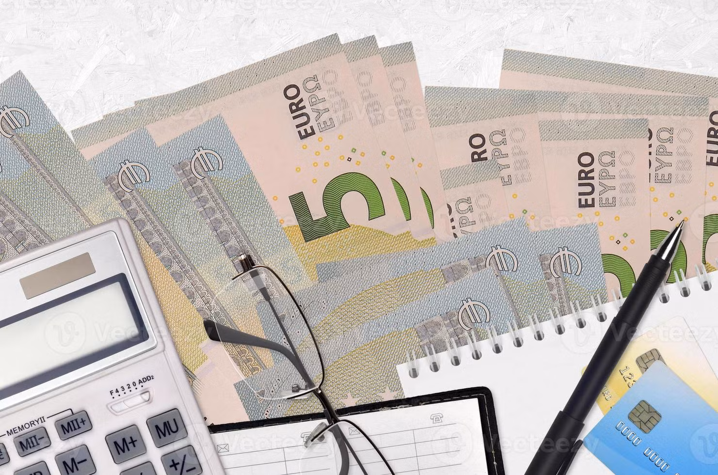 5-euro-bills-and-calculator-with-glasses-and-pen-tax-payment-concept-or-investment-solutions-financial-planning-or-accountant-paperwork-photo-117.jpg