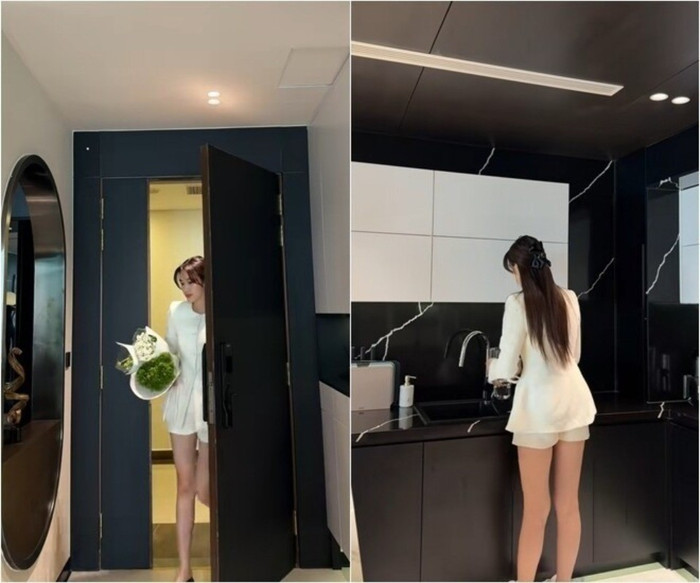 Ngay từ lối vào, không gian sống của Đỗ Thị Hà đã toát lên vẻ hiện đại với cánh cửa chính màu đen đầy sang trọng. Chiếc gương tròn cỡ lớn được đặt khéo léo bên cạnh vừa tạo điểm nhấn tinh tế, vừa giúp phản chiếu ánh sáng, khiến khu vực này trở nên rộng rãi và thoáng đãng hơn Ngay từ lối vào, không gian sống của Đỗ Thị Hà đã toát lên vẻ hiện đại với cánh cửa chính màu đen đầy sang trọng. Chiếc gương tròn cỡ lớn được đặt khéo léo bên cạnh vừa tạo điểm nhấn tinh tế, vừa giúp phản chiếu ánh sáng, khiến khu vực này trở nên rộng rãi và thoáng đãng hơn
