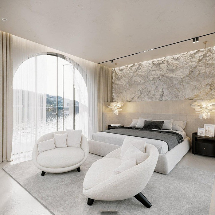 Không gian phòng ngủ thoáng đãng, có view hồ mát mẻ và cửa lớn giúp đón ánh sáng tự nhiên