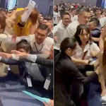 Các nhân viên môi giới giành giật phiếu mua căn hộ. Ảnh cắt từ clip